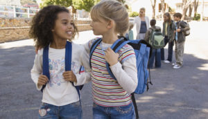 Classmates talking outdoors